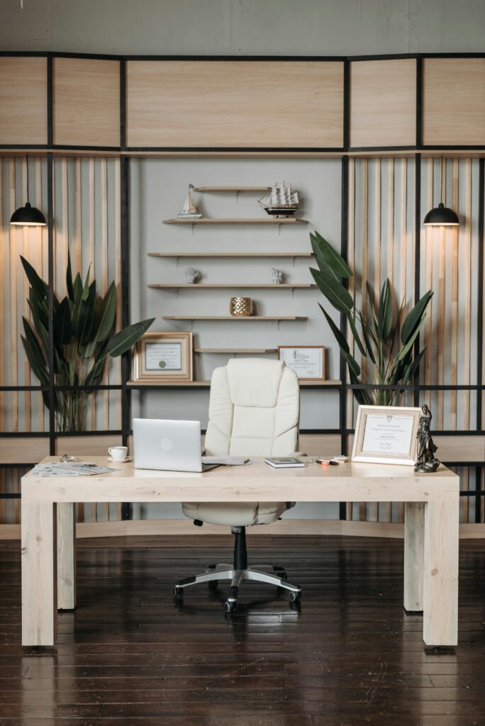 pexels-photo-8111792-8111792 Elegant home office featuring a sleek desk, comfortable armchair, and stylish decor setup.